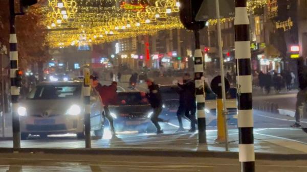 Israeli football supporters and Dutch youth clash near Amsterdam Central station, in Amsterdam, Netherlands, November 8, 2024, in this still image obtained from a social media video. Pic: Reuters/X/iAnnet