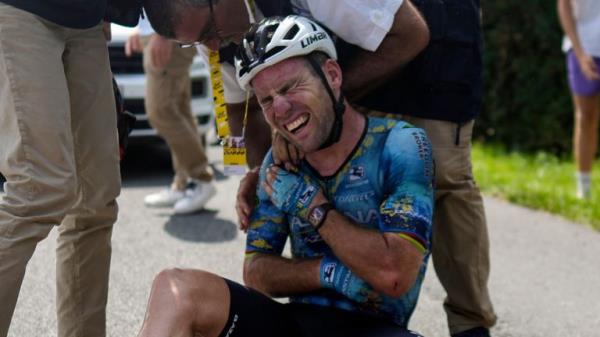 Mark Cavendish grimaces in pain as he receives medical assistance after crashing during the eighth stage of the Tour de France/ Pic: AP