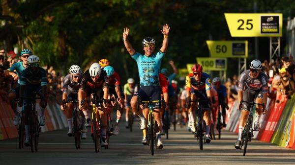 Mark Cavendish celebrates after crossing the line to win his last race in Singapore. Pic: Reuters