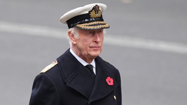 King Charles waits to lay his wreath. Pic: PA