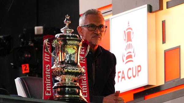 Gary Lineker next to the FA Cup trophy during the Emirates FA Cup fourth round match at Rodney Parade, Newport. Picture date: Sunday January 28, 2024. PA Photo. See PA story SOCCER Newport. Photo credit should read: Nick Potts/PA Wire...RESTRICTIONS: EDITORIAL USE o<em></em>nLY No use with unauthorised audio, video, data, fixture lists, club/league logos or "live" services. o<em></em>nline in-match use limited to 120 images, no video emulation. No use in betting, games or single club/league/player publications.