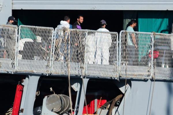 Migrants disembark from the Italian navy ship Libra at the port of Shengjin, northwestern Albania, Friday, Nov. 8, 2024, as a second group of eight migrants were intercepted in internatio<em></em>nal waters. (AP Photo/Vlasov Sulaj)