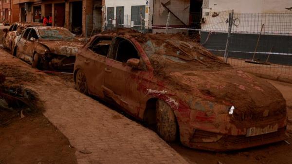 Flooding in Spain two weeks ago left cars damaged and covered in mud. Pic: Reuters