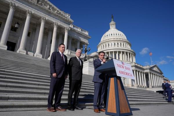 Mike Johnson on the steps of Congress, delivering a press conference.