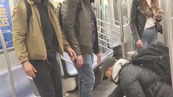 Screenshot from bystander video showing Jordan Neely being held in a chokehold on the New York City subway.