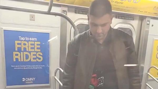 Screenshot from bystander video showing Jordan Neely being held in a chokehold on the New York City subway.