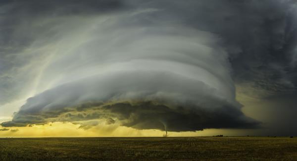 A photograph of a gray-ish, green-ish supercell and tornado in Silverton, Texas