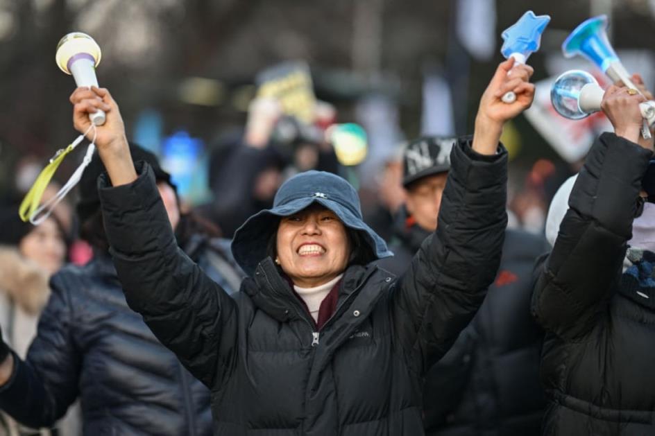 A protester cheers.