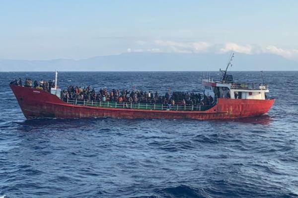 A cargo ship carries migrants during a rescue operation, as it sails off the island of Crete, Greece, October 29, 2021. Hellenic Coast Guard/Handout via REUTERS ATTENTION EDITORS - THIS IMAGE WAS PROVIDED BY A THIRD PARTY.