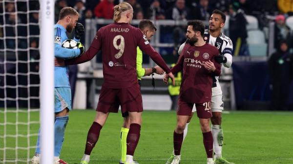 Manchester City's Bernardo Silva with referee Clement Turpin during the UEFA Champions League, league stage match at the Allianz Stadium, Turin, Italy. Picture date: Wednesday December 11, 2024. PA Photo. See PA story SOCCER Man City. Photo credit should read: Fabrizio Carabelli/PA Wire...RESTRICTIONS: Use subject to restrictions. Editorial use only, no commercial use without prior co<em></em>nsent from rights holder.