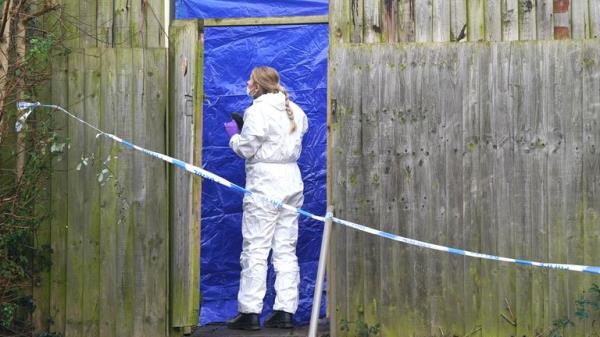 A forensic investigator at the scene on Fownhope Close in Redditch.
Pic: PA