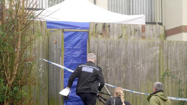 Police crime scene investigators at the scene on Fownhope Close in Redditch.
Pic: PA