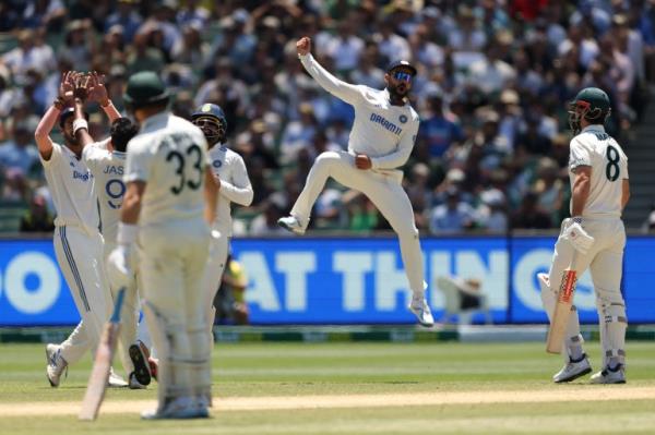 MELBOURNE, AUSTRALIA - DECEMBER 29: Jasprit Bumrah of India celebrates the wicket of Mitchell Marsh of Australia during day four of the Men's Fourth Test Match in the series between Australia and India at Melbourne Cricket Ground on December 29, 2024 in Melbourne, Australia. (Photo by Robert Cianflone/Getty Images)