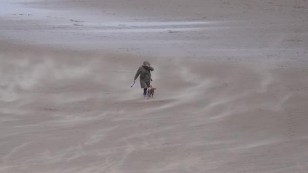 Sand is whipped up by the wind on Tynemouth Lo<em></em>ngsands on the North East coast of England. Snow, rain and wind warnings are in force and are expected to cause travel issues on New Year's Eve. Picture date: Tuesday December 31, 2024.