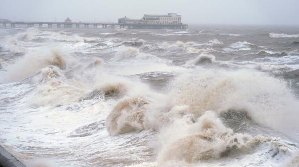 Waves break on the sea front in Blackpool, as snow, rain and wind warnings are in force and are expected to cause travel issues on New Year's Eve. Picture date: Tuesday December 31, 2024.