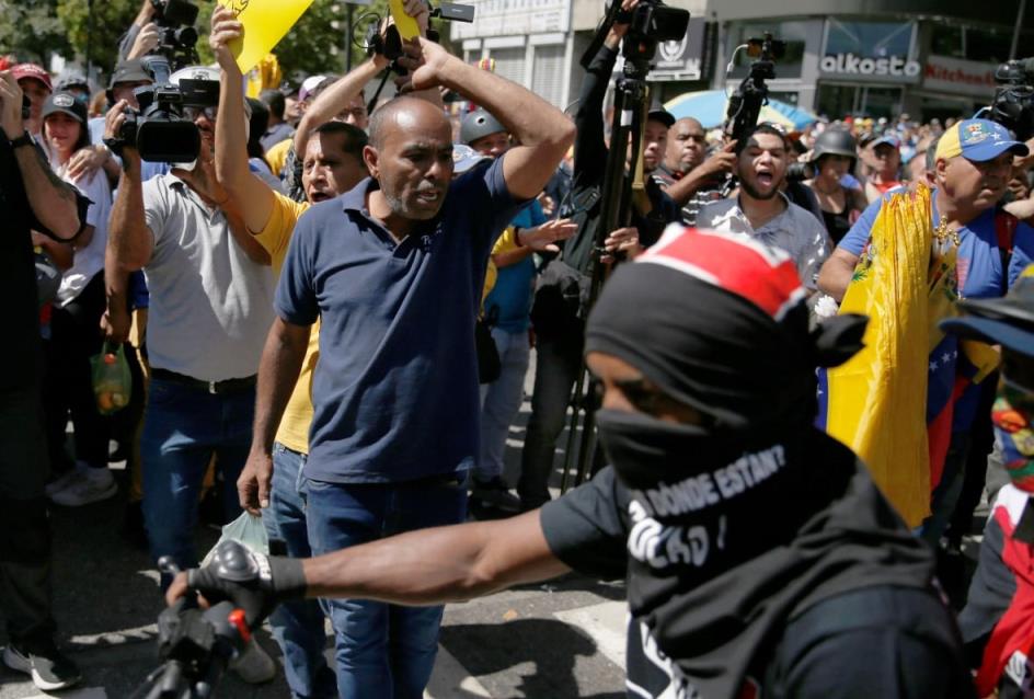 People protest outside.