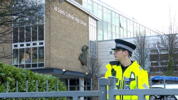 Police officers outside All Saints Catholic High School, on Granville Road in Sheffield.
Pic: PA  