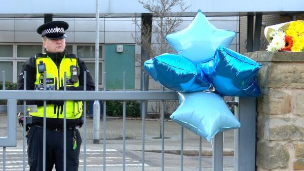 Tributes left outside All Saints Catholic High School, on Granville Road in Sheffield.
Pic: PA