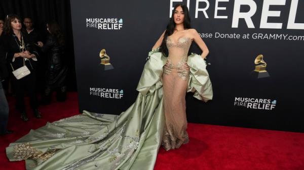 Madison Beer in sheer, green and gold. Pic: AP