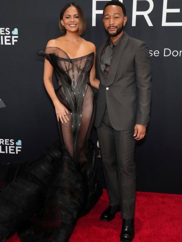 Chrissy Teigen and John Legend looking elegant in black. Legend is presenting an award tonight. Pic: AP