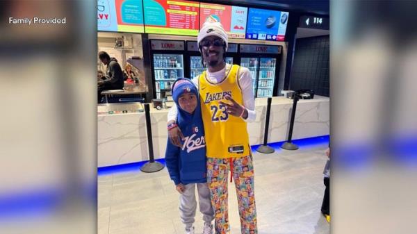 Andre Howard III at NBA game with Laker fan