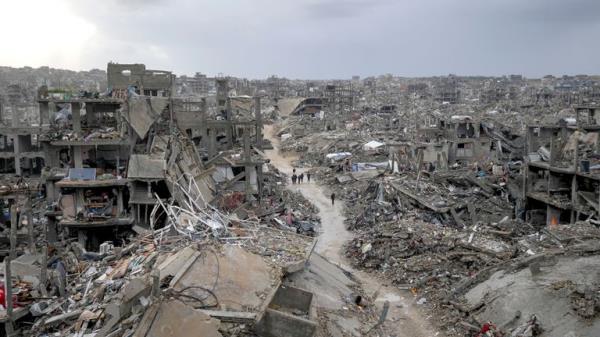 Palestinians walk in the destruction caused by the Israeli air and ground offensive in Jabaliya, Gaza Strip, Thursday, Feb. 6, 2025. (AP Photo/Abdel Kareem Hana)