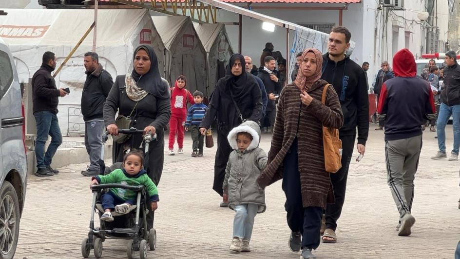 Families walking in Gaza City.