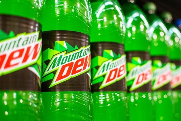 Manila, Philippines - July 2020: A row of Mountain Dew 1.5 Liter soda on display at an aisle in a supermarket.