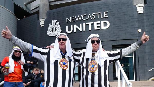 Newcastle United fans celebrate the Saudi takeover in 2021. Pic: AP