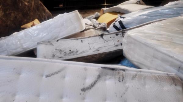 Old mattresses at a recycling centre 