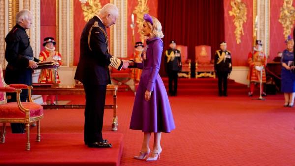 Amy Dowden and King Charles during her Investiture at Buckingham Palace.
Pic: PA