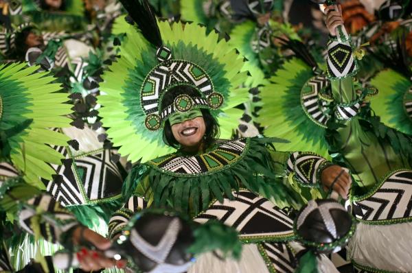 A reveler of the Salgueiro samba school performs during the second night of Carnival