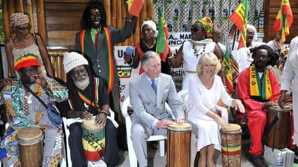 File photo dated 12/3/2008 of Prince Charles and the Duchess of Cornwall Camilla play with a rasta band at the home of the late reggae singer Bob Marley which is now the Bob Marley museum, in Kingston, Jamaica. Arthur Edwards/The Sun/PA Wire