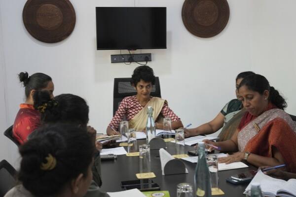 Resort manager Jeewanthi Adikari, center, attends a management meeting with the staff of Amba Yaalu resort in the Kandalama locality in Dambulla, Sri Lanka, Friday, Feb. 21, 2025. (AP Photo/Eranga Jayawardena)