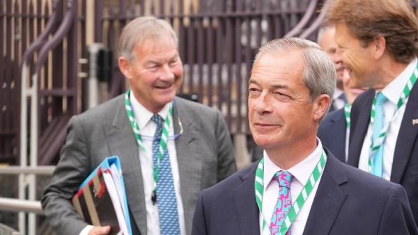 Mr Lowe, left, with Nigel Farage after getting elected as MPs last year. Pic: PA