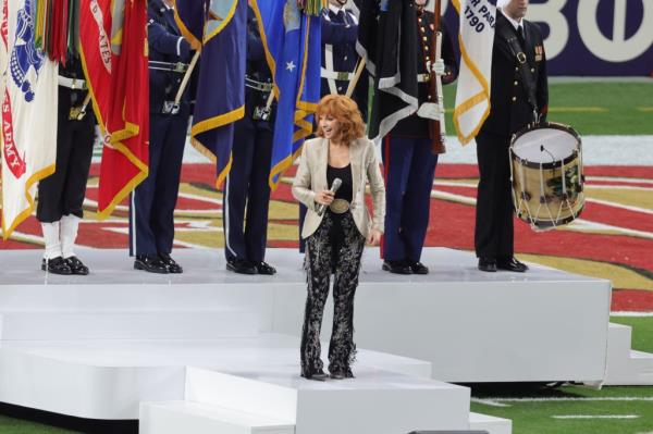 Reba McEntire sings the United States natio<em></em>nal anthem before Super Bowl LVIII