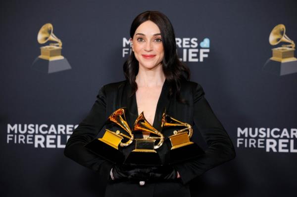 St. Vincent with three of her awards from the night.