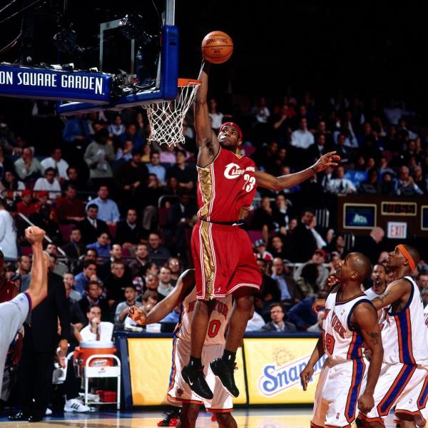 LeBron James #23 of the Cleveland Cavaliers drives to the basket for a dunk against the New York Knicks on April 14, 2004 at Madison Square Garden in New York, New York. 