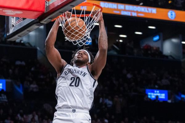 Brooklyn Nets center Day'Ron Sharpe (20) dunks in the first half against the Sacramento Kings at Barclays Center, Monday, Jan. 27, 2025, in Brooklyn, NY.