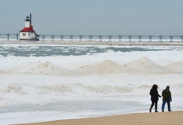 Ice builds up along the Lake Michigan shoreline Friday, Feb. 14, 2025, in St. Joseph, Mich.(Don Campbell/The Herald-Palladium via AP)