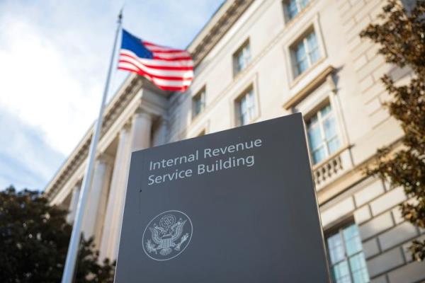 A sign for the Internal Revenue Service (IRS) is seen outside its building on February 13, 2025 in Washington, DC. (Photo by Kayla Bartkowski/Getty Images)