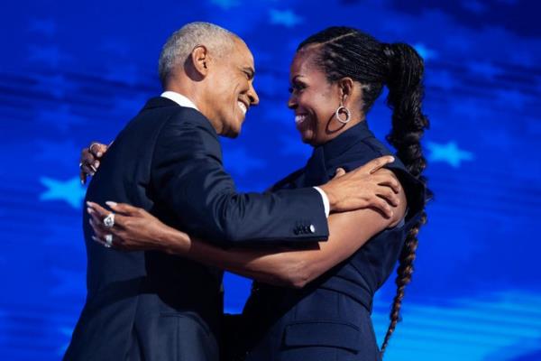 Former President Barack Obama and former first lady Michelle Obama appear on stage in between their addresses on the second night of the Democratic Natio<em></em>nal Co<em></em>nvention at the United Center in Chicago, Ill., on Tuesday, August 20, 2024. 