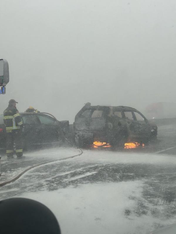 An SUV caught fire during a pileup on I-84 in Oregon on Thursday. More than 100 vehicles were involved in the pileup during whiteout conditions.