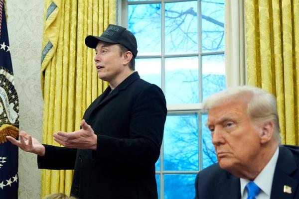 President Do<em></em>nald Trump listens as Elon Musk speaks in the Oval Office at the White House on Feb. 11, 2025. 