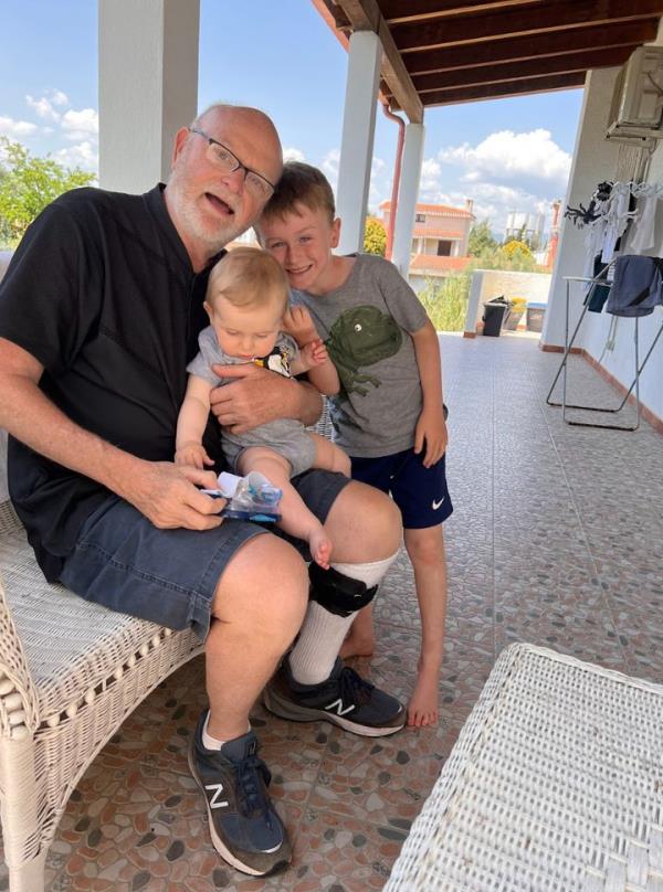 Joel playing with grandchildren Stanley and George in Sardinia, Italy. 