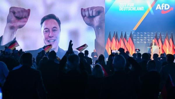 People protest during a rally against Elon Musk outside the Treasury Department in Washington, Tuesday, Feb. 4, 2025. (AP Photo/Jose Luis Magana)