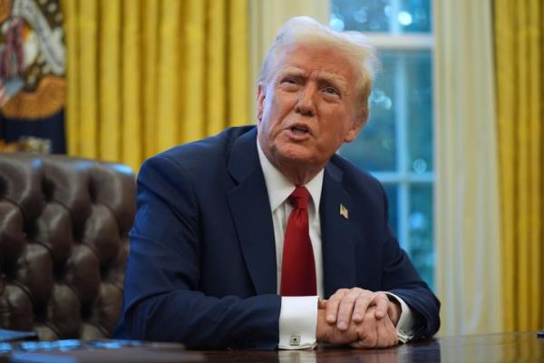 President Do<em></em>nald Trump speaks as he signs executive orders in the Oval Office Thursday in Washington.