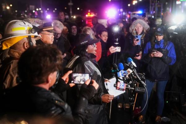 Philadelphia Mayor Cherelle Parker, center, speaks during a news co<em></em>nference following a plane crash in Philadelphia, Friday, Jan. 31, 2025. (AP Photo/Matt Rourke)